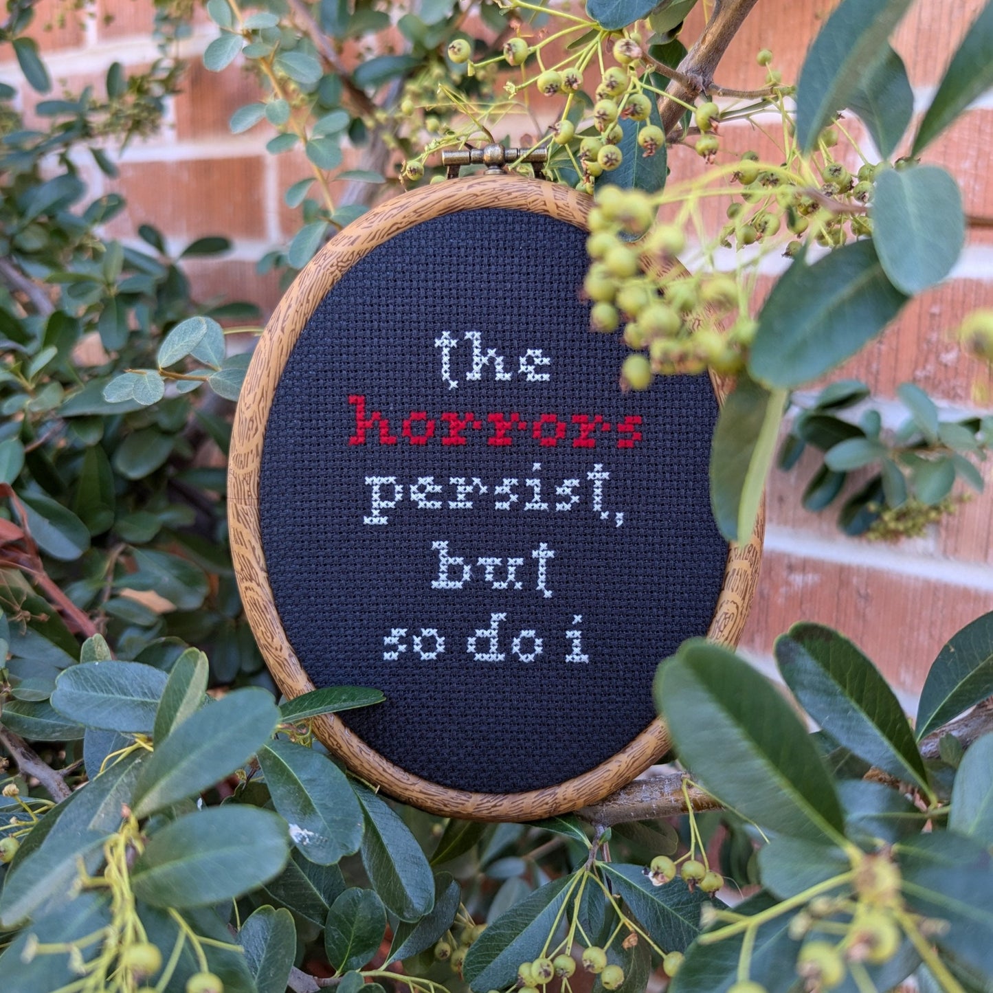 "The Horrors Persist, But So Do I" Wall Art