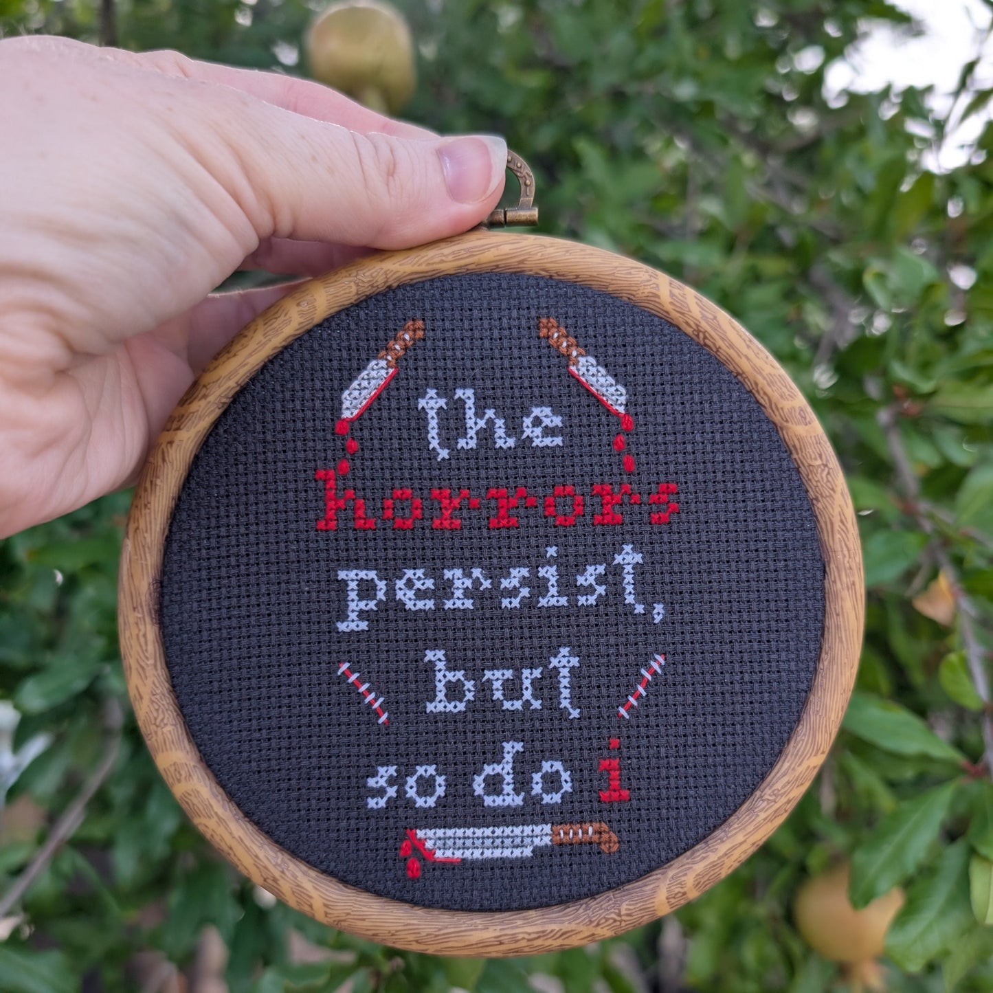 "The Horrors Persist, But So Do I" Wall Art